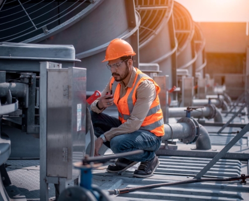 Maintenance worker inspecting chiller
