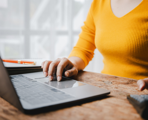 Portrait of a woman working on a tablet computer in a modern office